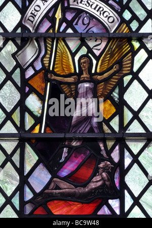 Stained glass depicting Epstein`s St. Michael and the Devil sculpture, Hampton-in-Arden Church, West Midlands, England, UK Stock Photo